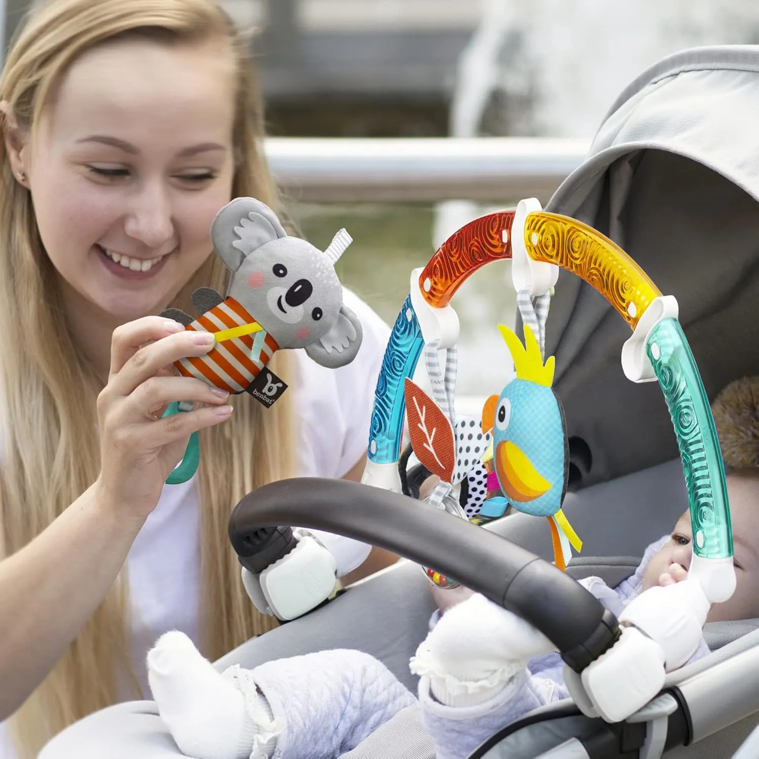 BENBAT Baby Stroller Arch Toy Rainbow Dazzle Friends Play Bar. Fun Newborns Sensory Activity, Adjustable for Bouncers and Car Seat, Koala
