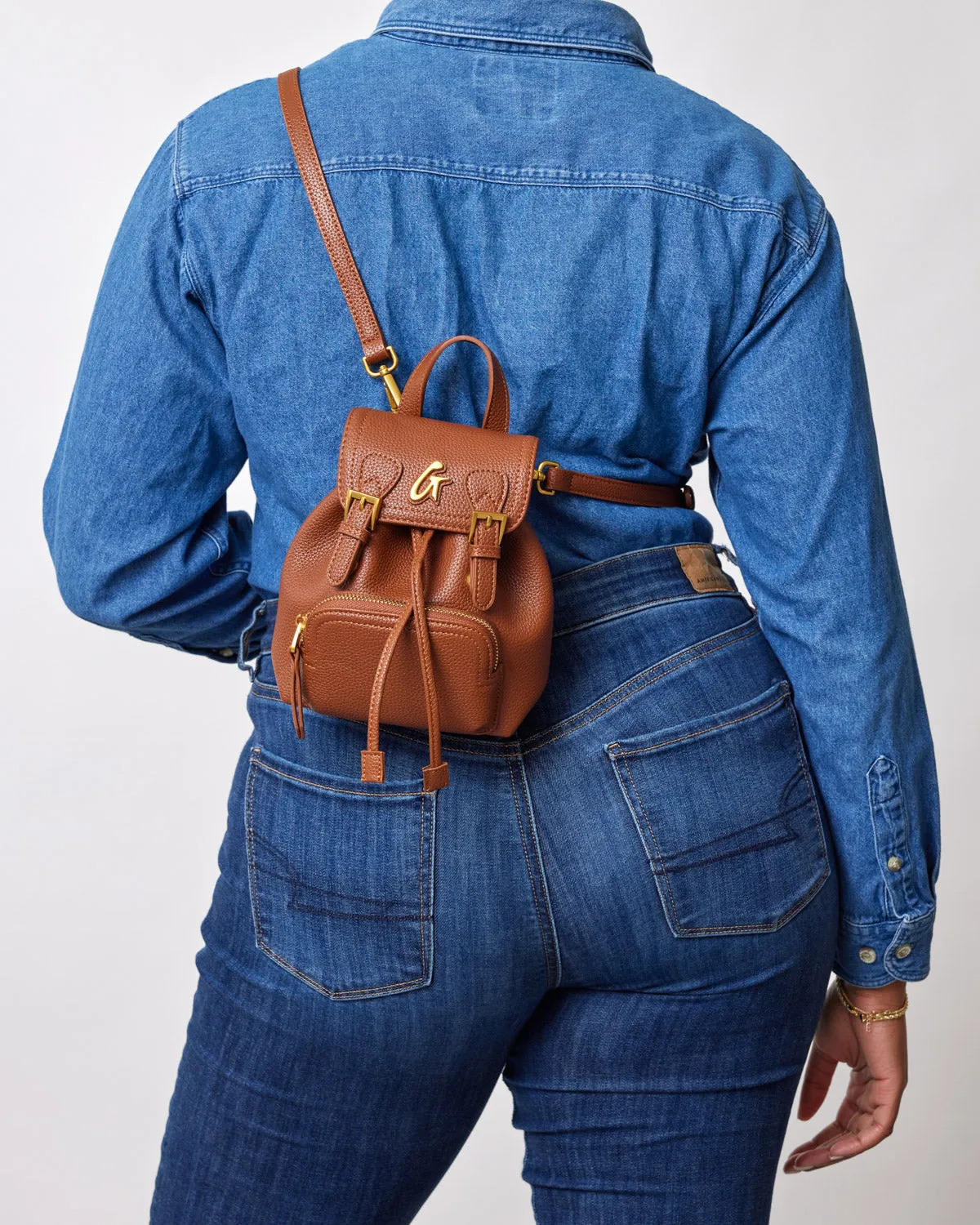 MINI PEBBLE CROSSBODY BACKPACK - BROWN